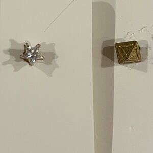 2 pierced studs. 1 gold star w faux diamond, 2 gold pyramid.  Super cute…